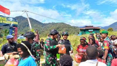 Satgas Yonif 405/SK Berbagi Kebahagiaan dengan Masyarakat Jila Papua